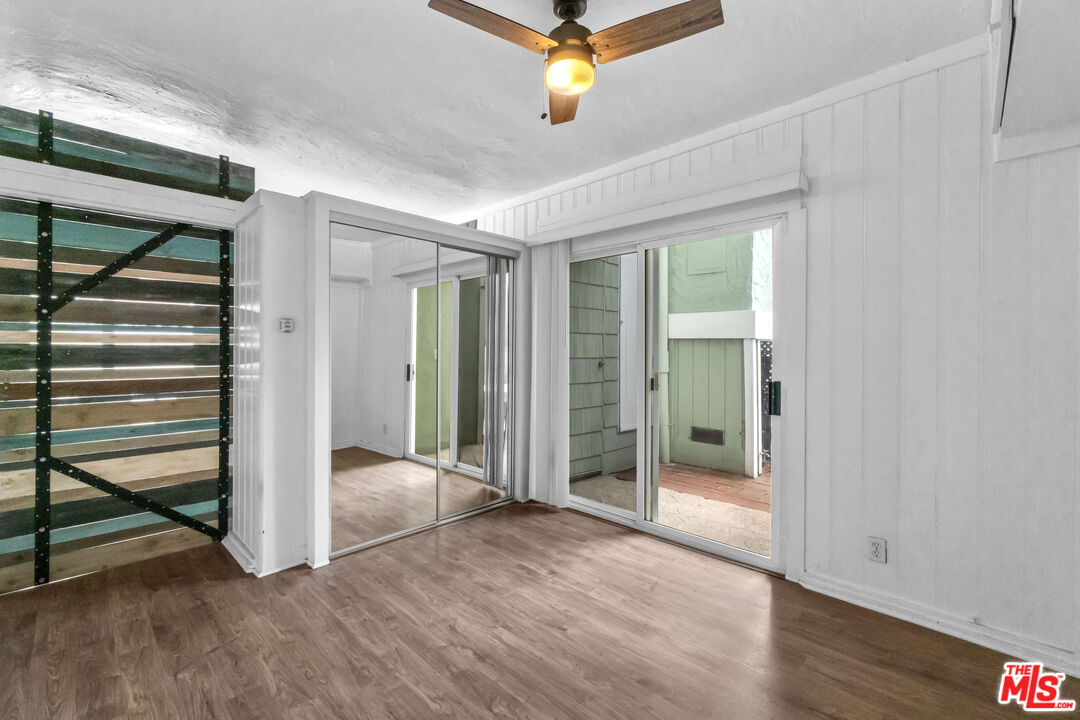 115 44th Street Manhattan Beach, CA 90266 - Photo 21 of 38 wooden floor in an empty room with a window
