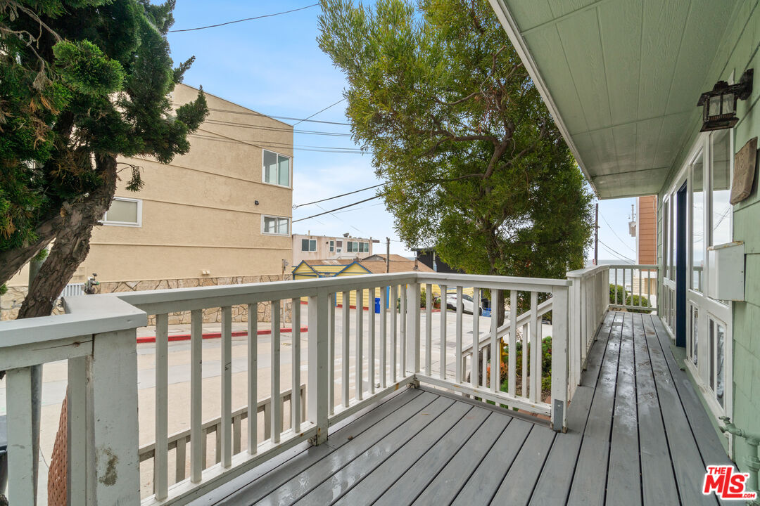 115 44th Street Manhattan Beach, CA 90266 - Photo 28 of 38 view of balcony with wooden floor and fence