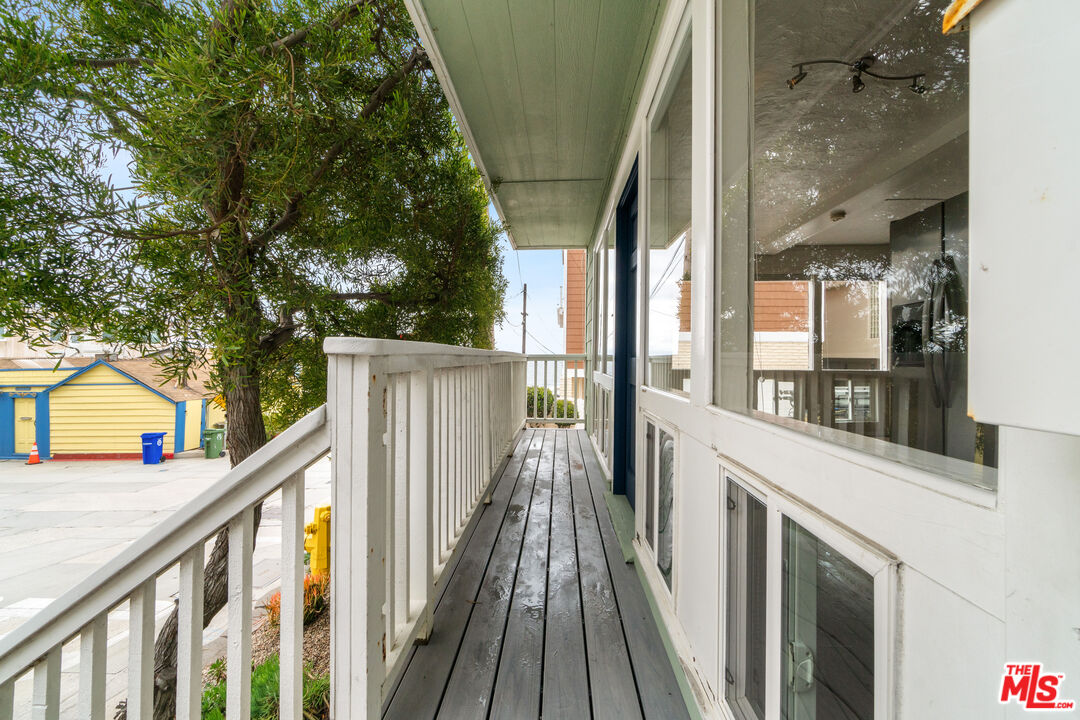 115 44th Street Manhattan Beach, CA 90266 - Photo 29 of 38 a view of balcony with wooden floor and fence