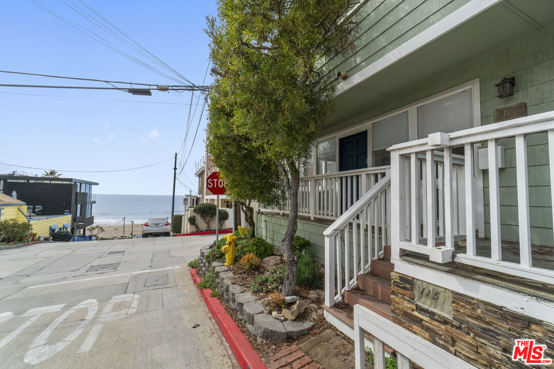 115 44th Street Manhattan Beach, CA 90266 - Photo 31 of 38 a view of balcony with wooden floor and outdoor seating