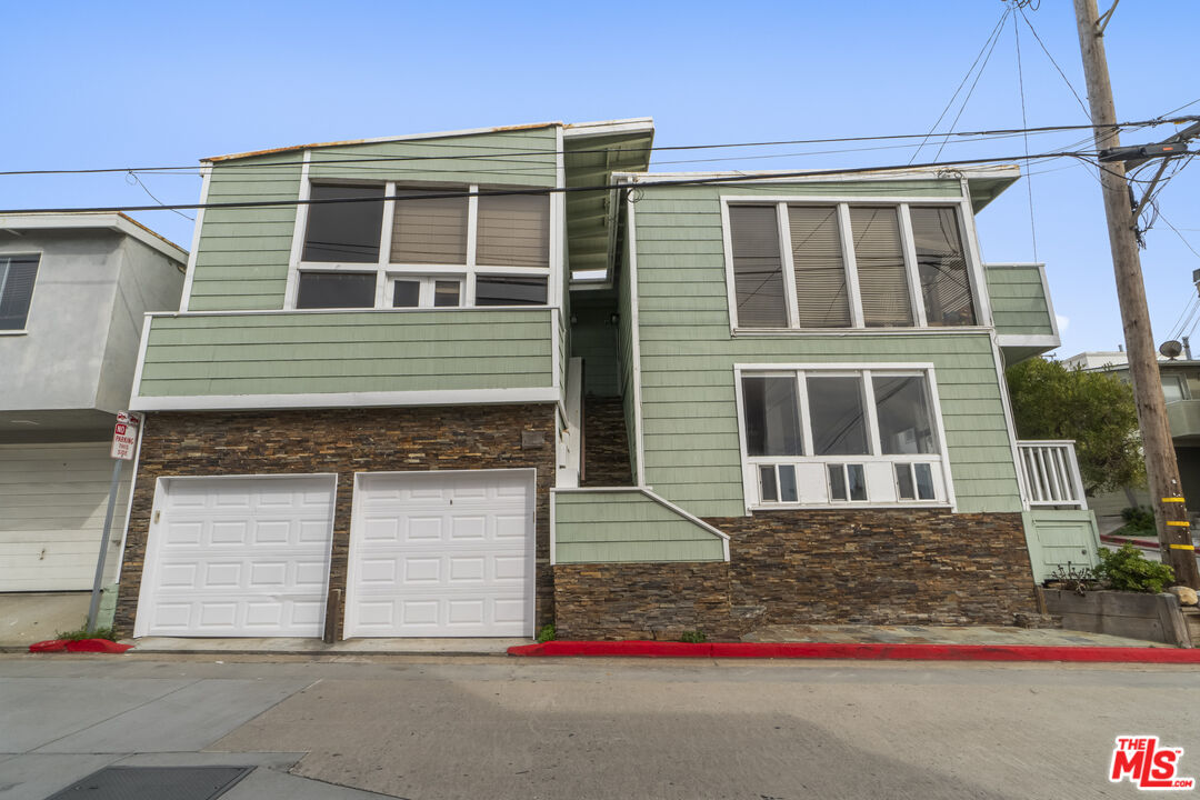 115 44th Street Manhattan Beach, CA 90266 - Photo 32 of 38 a front view of a house with garage