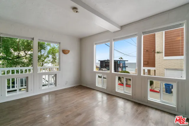 a kitchen with stainless steel appliances granite countertop a stove and a large window