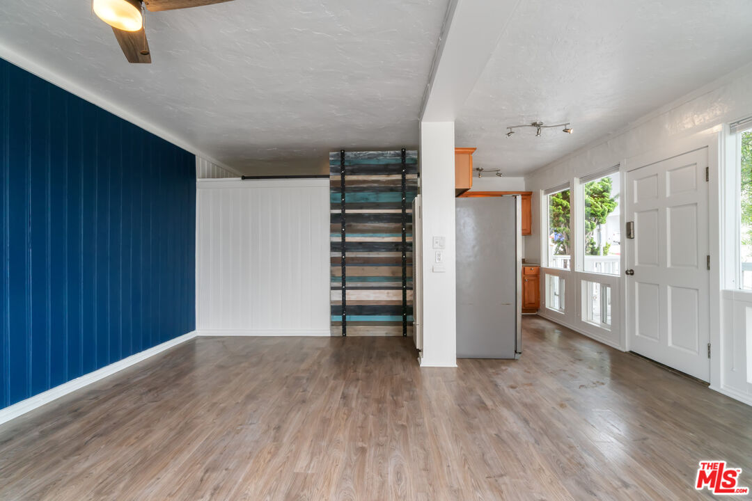 115 44th Street Manhattan Beach, CA 90266 - Photo 7 of 38 an empty room with wooden floor closet and windows