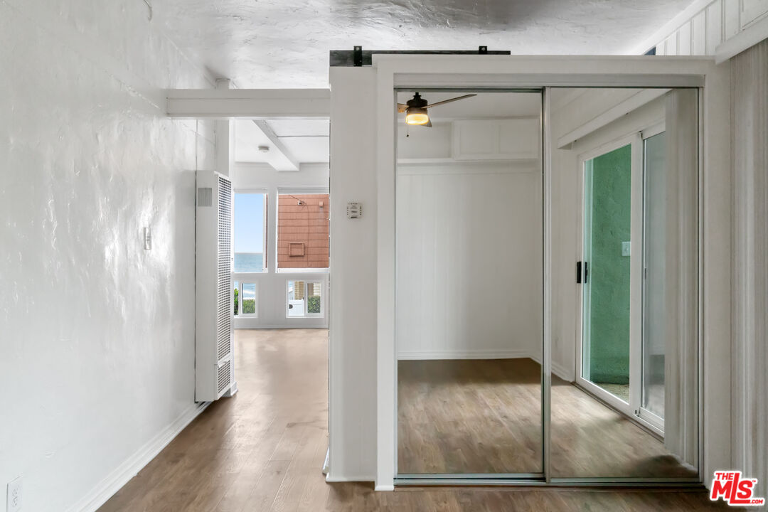 115 44th Street Manhattan Beach, CA 90266 - Photo 10 of 38 a view of a hallway with wooden floor