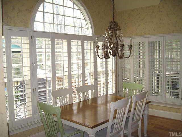 Bright breakfast area with tall cathedral ceiling & palladian window Other