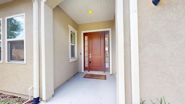 a view of a room that has a bed and a window