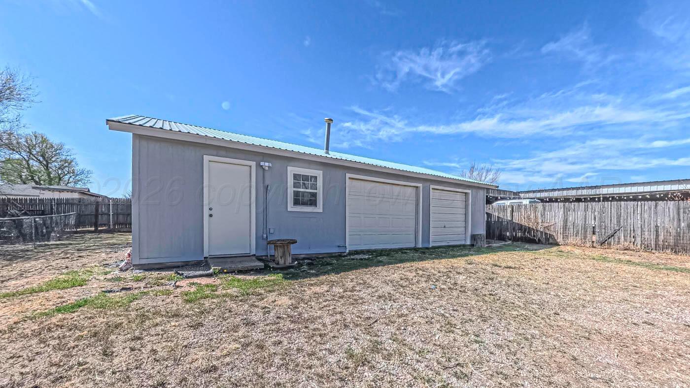 1316 Withers Avenue Amarillo, TX 79108 - Photo 4 of 19 a view of a house with a yard