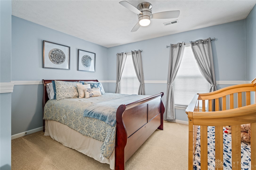 55 Janney Lane Springboro, OH 45066 - Photo 28 of 38 This serene bedroom offers a calming ambiance and cozy carpet flooring.