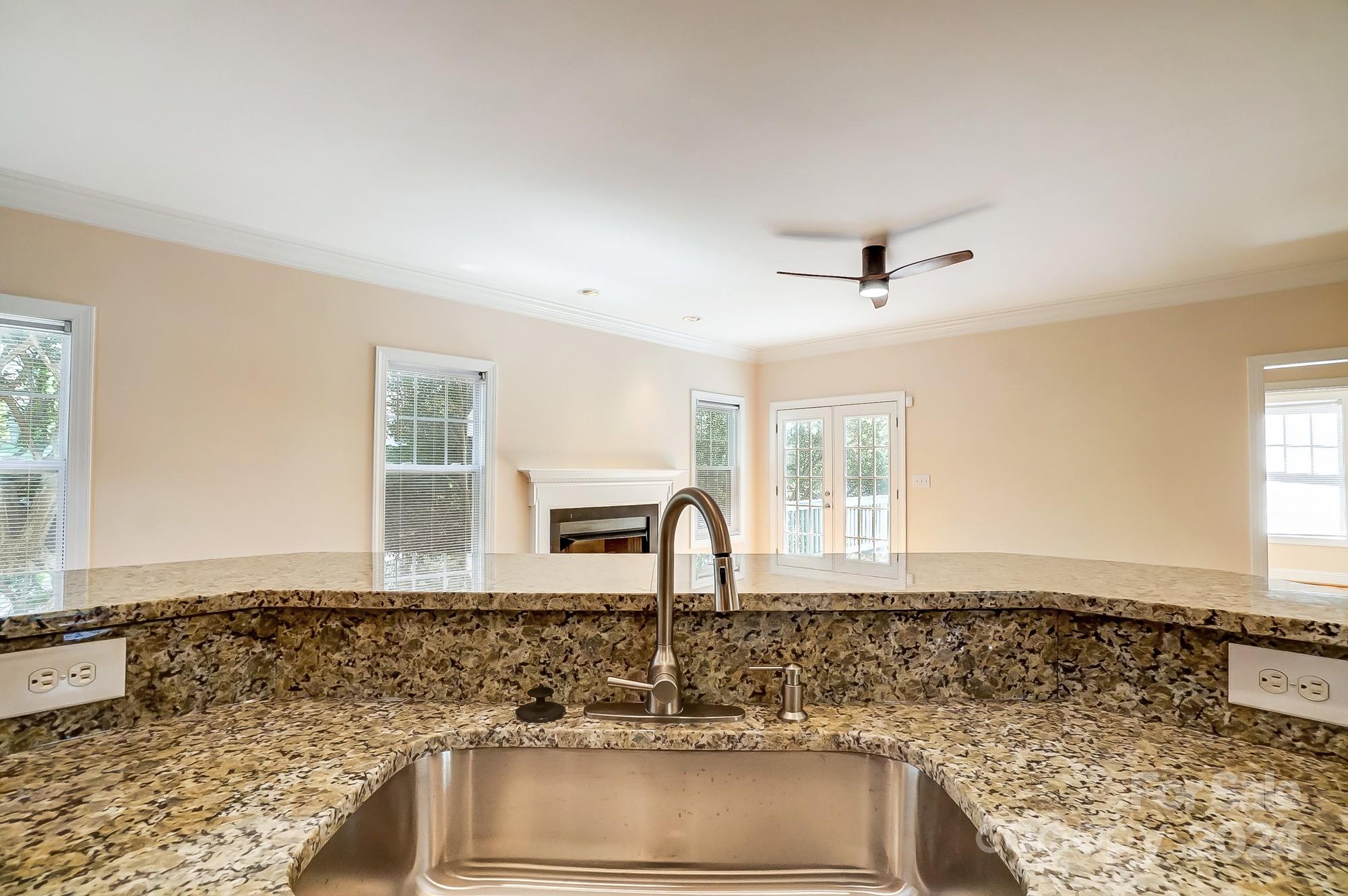 14137 Wild Elm Road Charlotte, NC 28277 - Photo 13 of 36 a bathroom with granite countertop a sink and a window