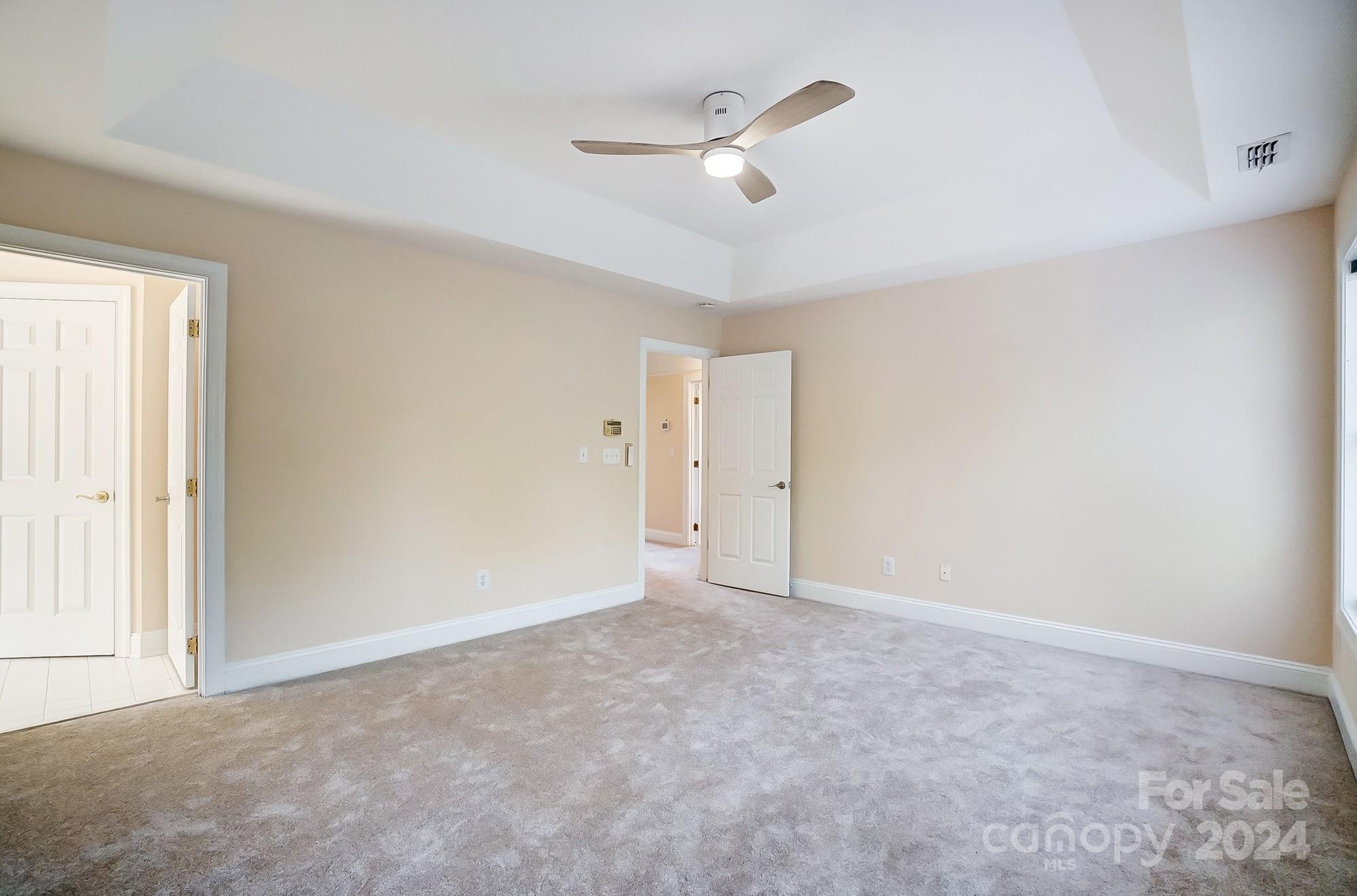 14137 Wild Elm Road Charlotte, NC 28277 - Photo 20 of 36 a view of an empty room with a window