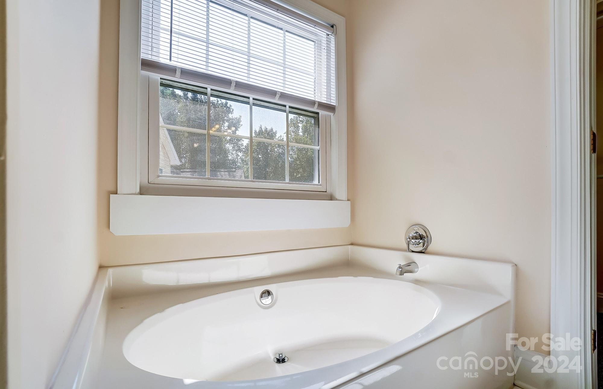 14137 Wild Elm Road Charlotte, NC 28277 - Photo 24 of 36 a bathroom with sink and a window