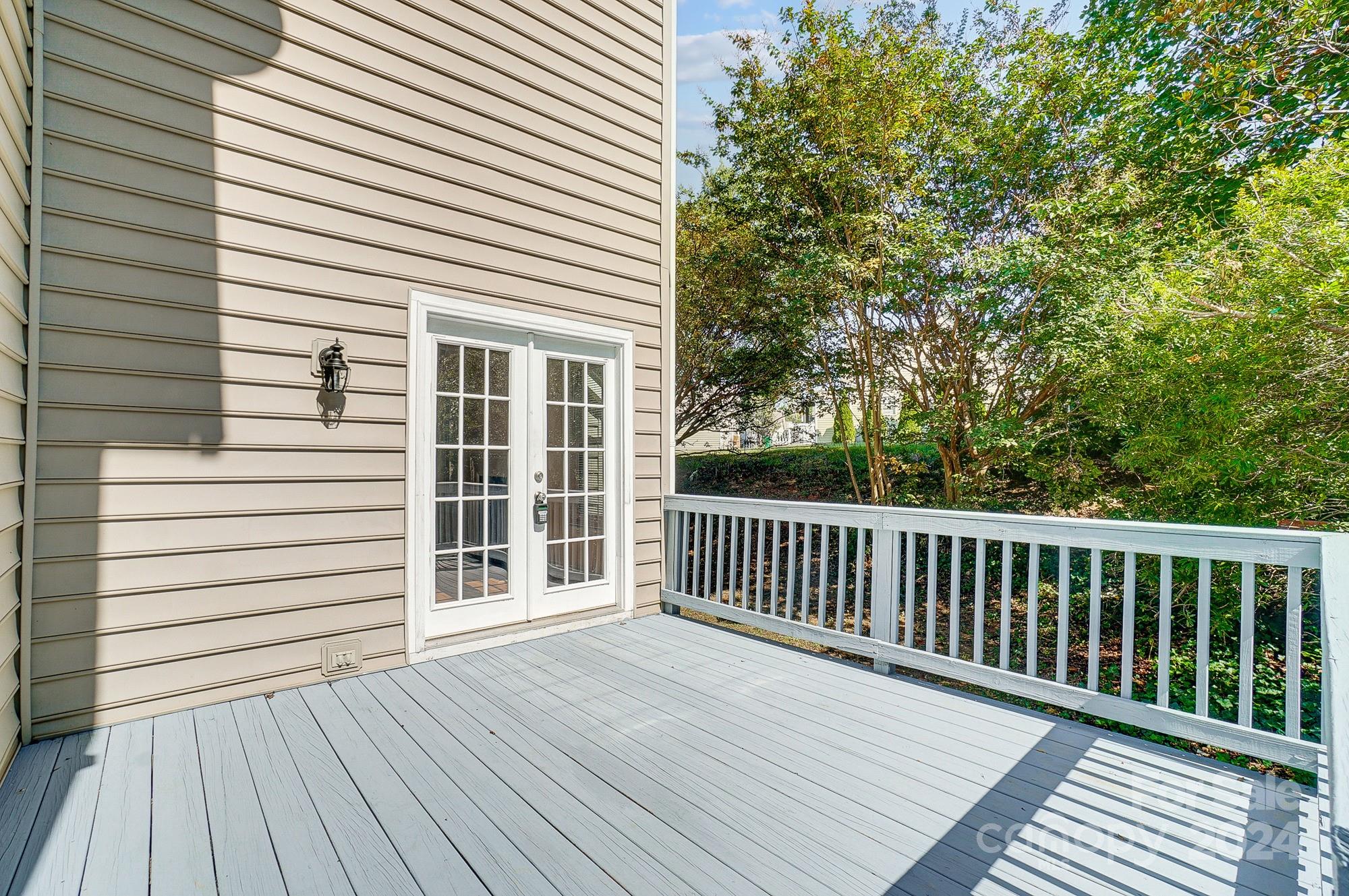 14137 Wild Elm Road Charlotte, NC 28277 - Photo 33 of 36 a view of a wooden deck