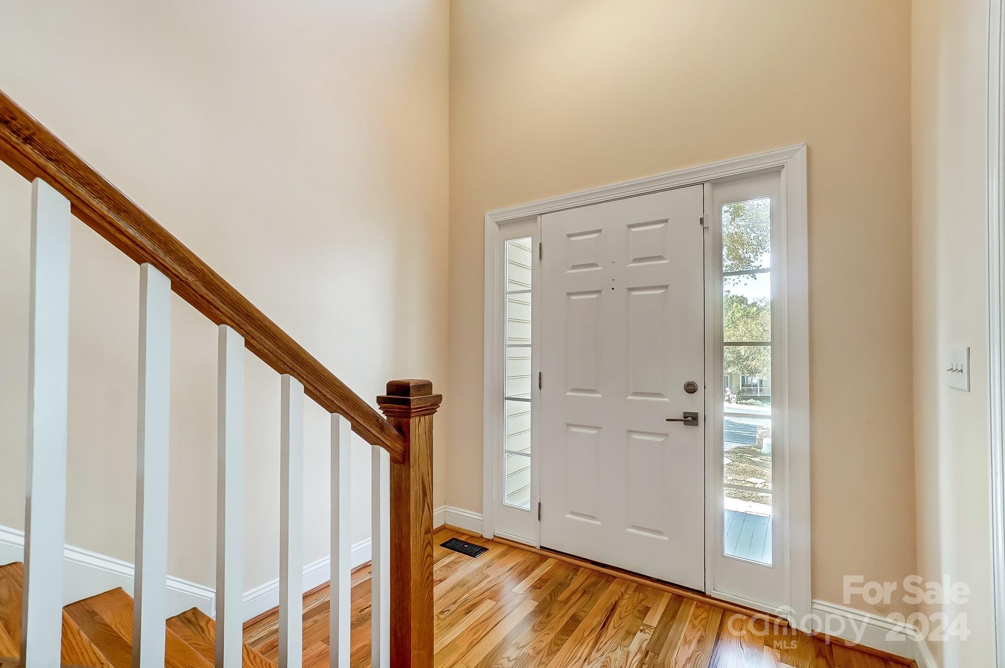 14137 Wild Elm Road Charlotte, NC 28277 - Photo 4 of 36 a view of an entryway with wooden floor