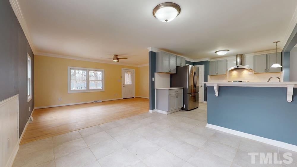 6212 Garrett Road Raleigh, NC 27606 - Photo 9 of 31 a view of kitchen with refrigerator and window