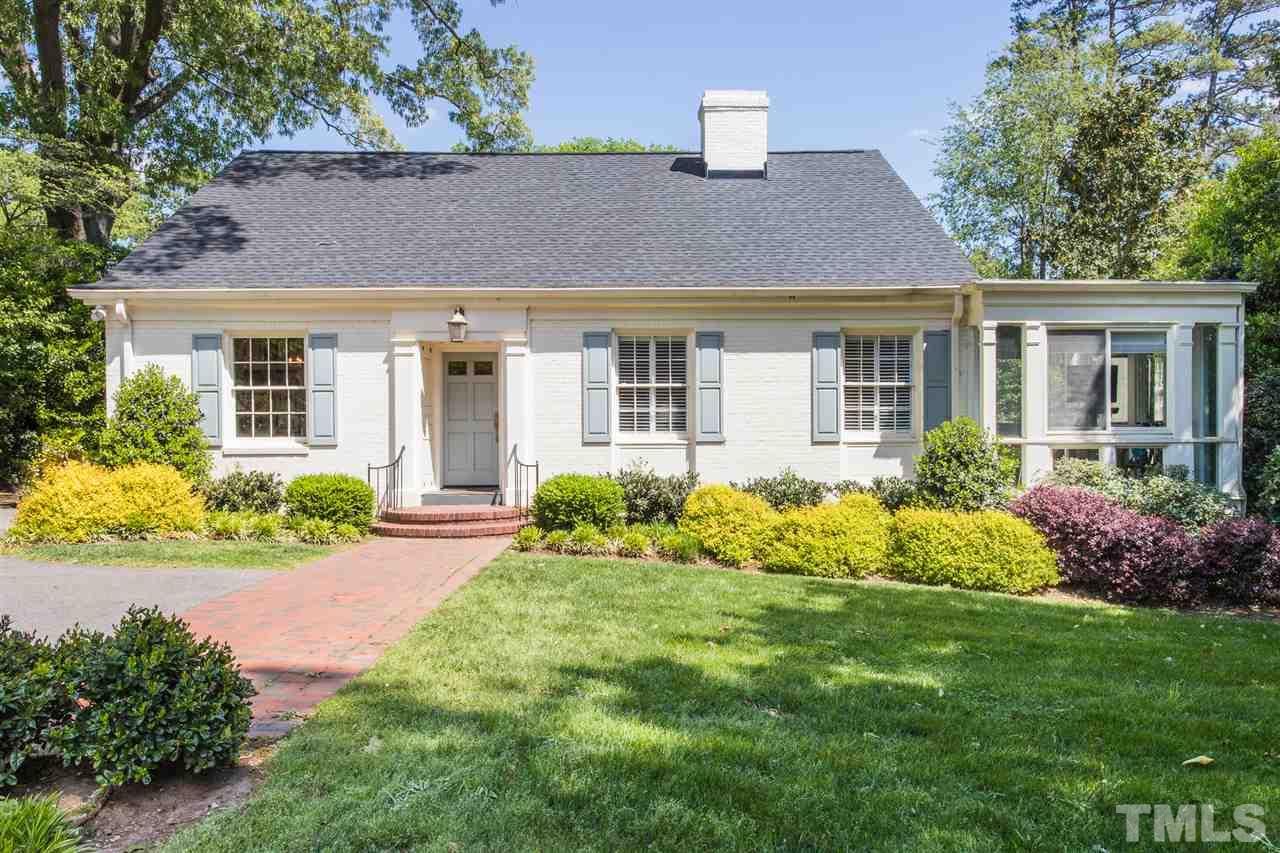 1424 Canterbury Road Raleigh, NC 27608 - Photo 1 of 29 a front view of a house with garden and porch