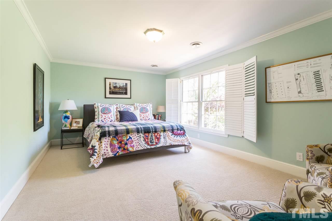 1424 Canterbury Road Raleigh, NC 27608 - Photo 16 of 29 a bedroom with a bed and window