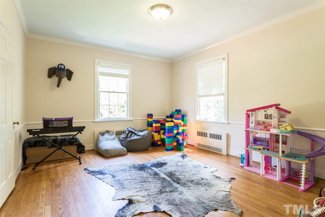 1424 Canterbury Road Raleigh, NC 27608 - Photo 22 of 29 a view of a workspace with furniture and a window