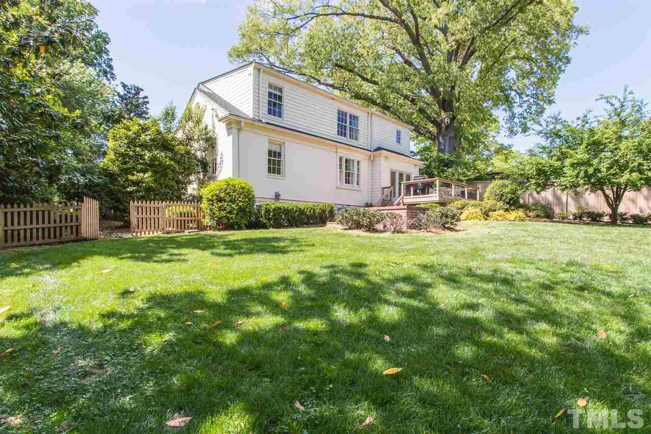 1424 Canterbury Road Raleigh, NC 27608 - Photo 27 of 29 a view of a house with yard and a tree