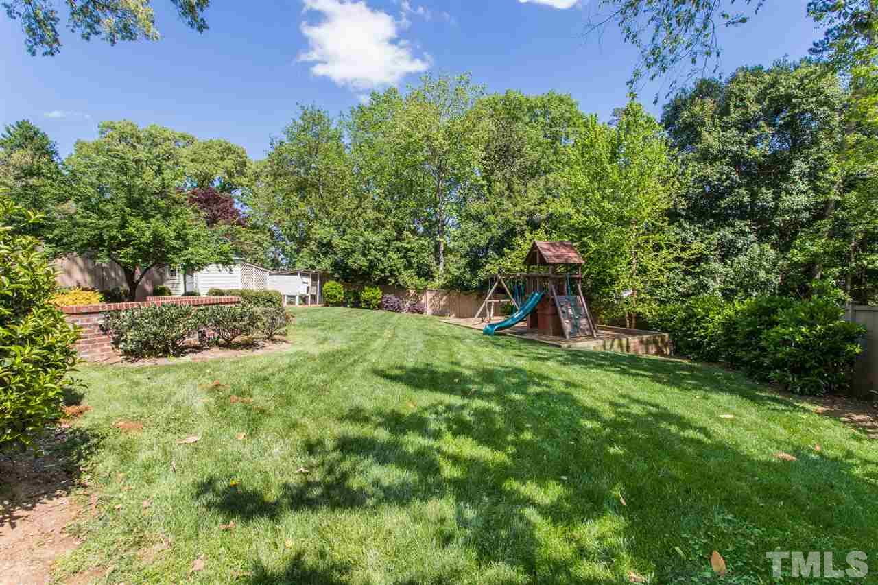1424 Canterbury Road Raleigh, NC 27608 - Photo 28 of 29 a view of a park with large trees