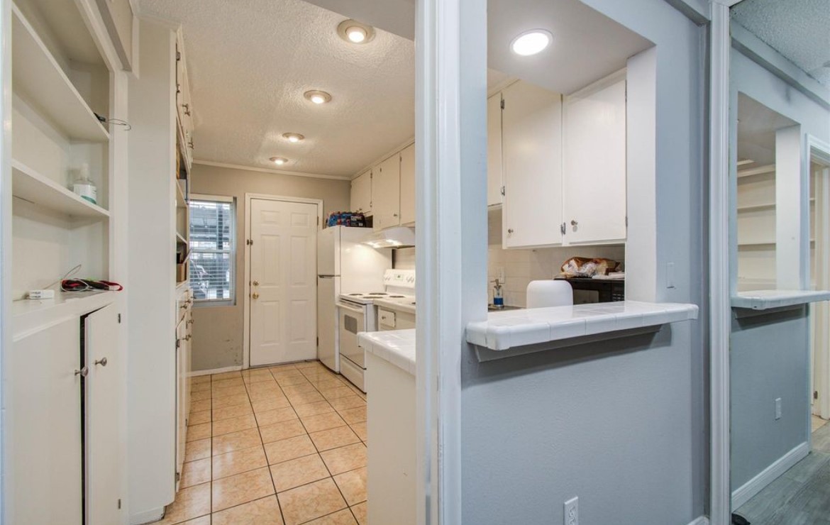 11609 Chimney Rock Road, Unit B Houston, TX 77035 - Photo 11 of 22 a view of a kitchen from the hallway