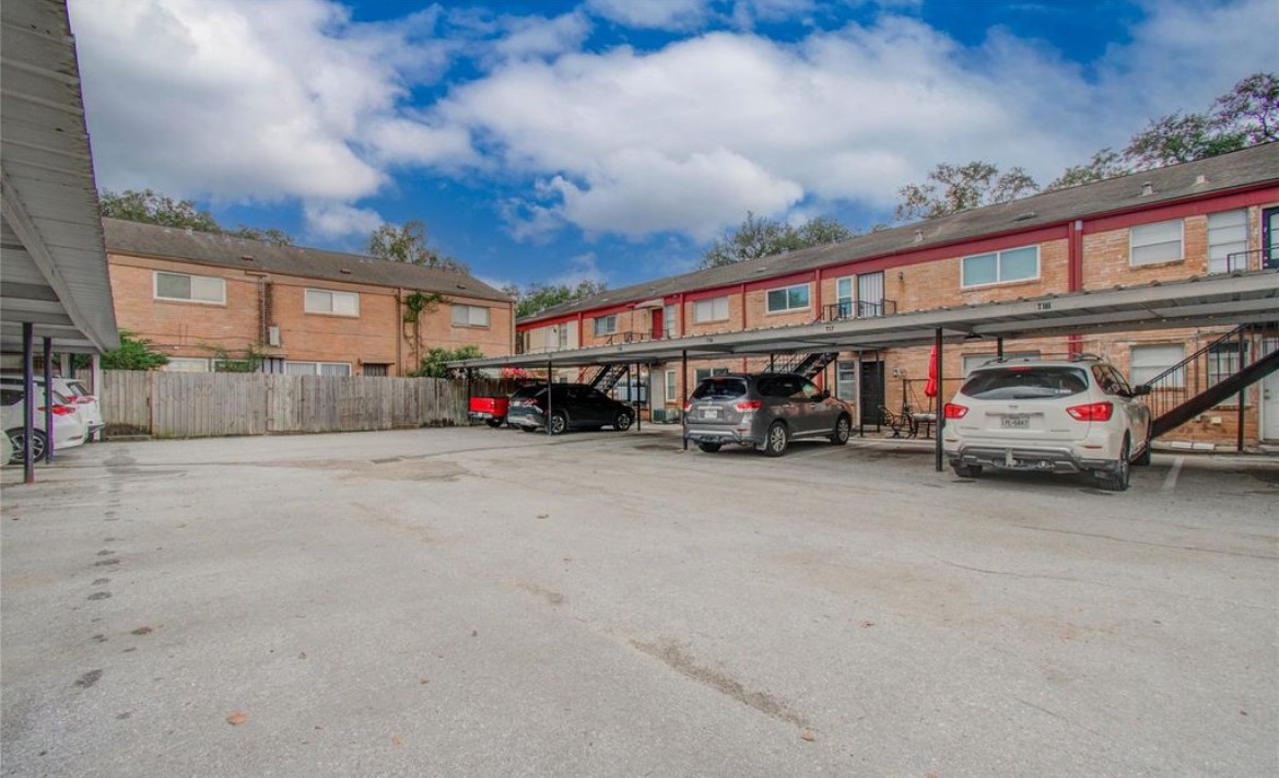 11609 Chimney Rock Road, Unit B Houston, TX 77035 - Photo 20 of 22 a car parked in front of a building