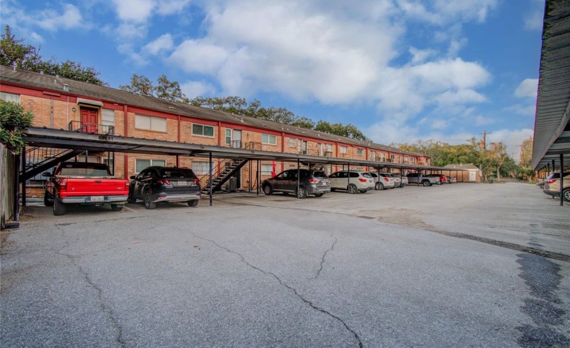 11609 Chimney Rock Road, Unit B Houston, TX 77035 - Photo 21 of 22 a view of car parked in front of a building
