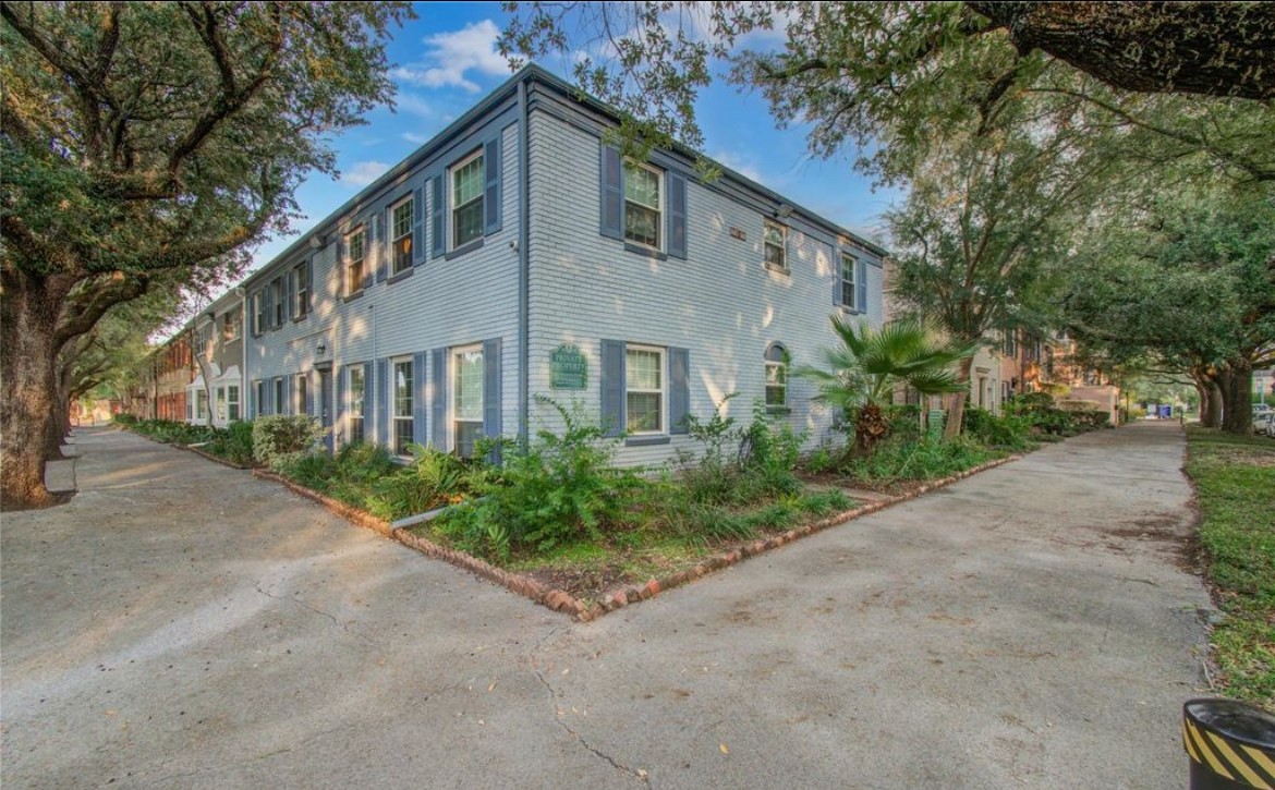 11609 Chimney Rock Road, Unit B Houston, TX 77035 - Photo 3 of 22 a front view of a house with garden