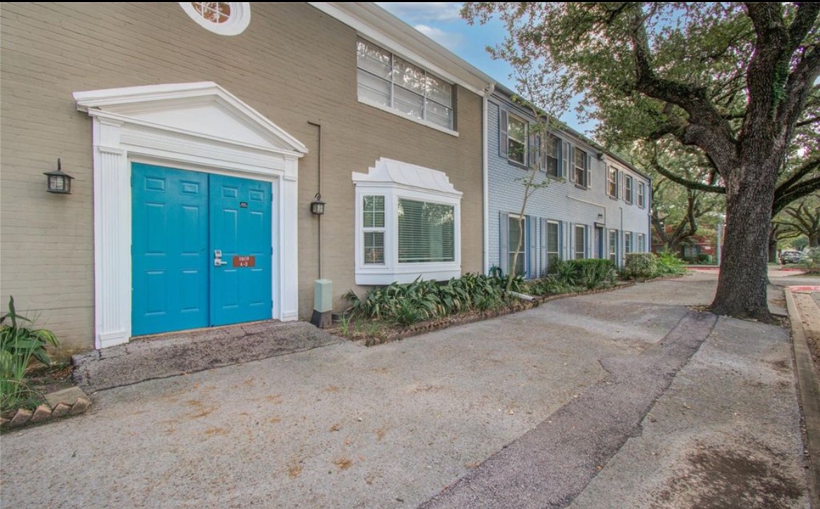 11609 Chimney Rock Road, Unit B Houston, TX 77035 - Photo 6 of 22 a view of a building with a street