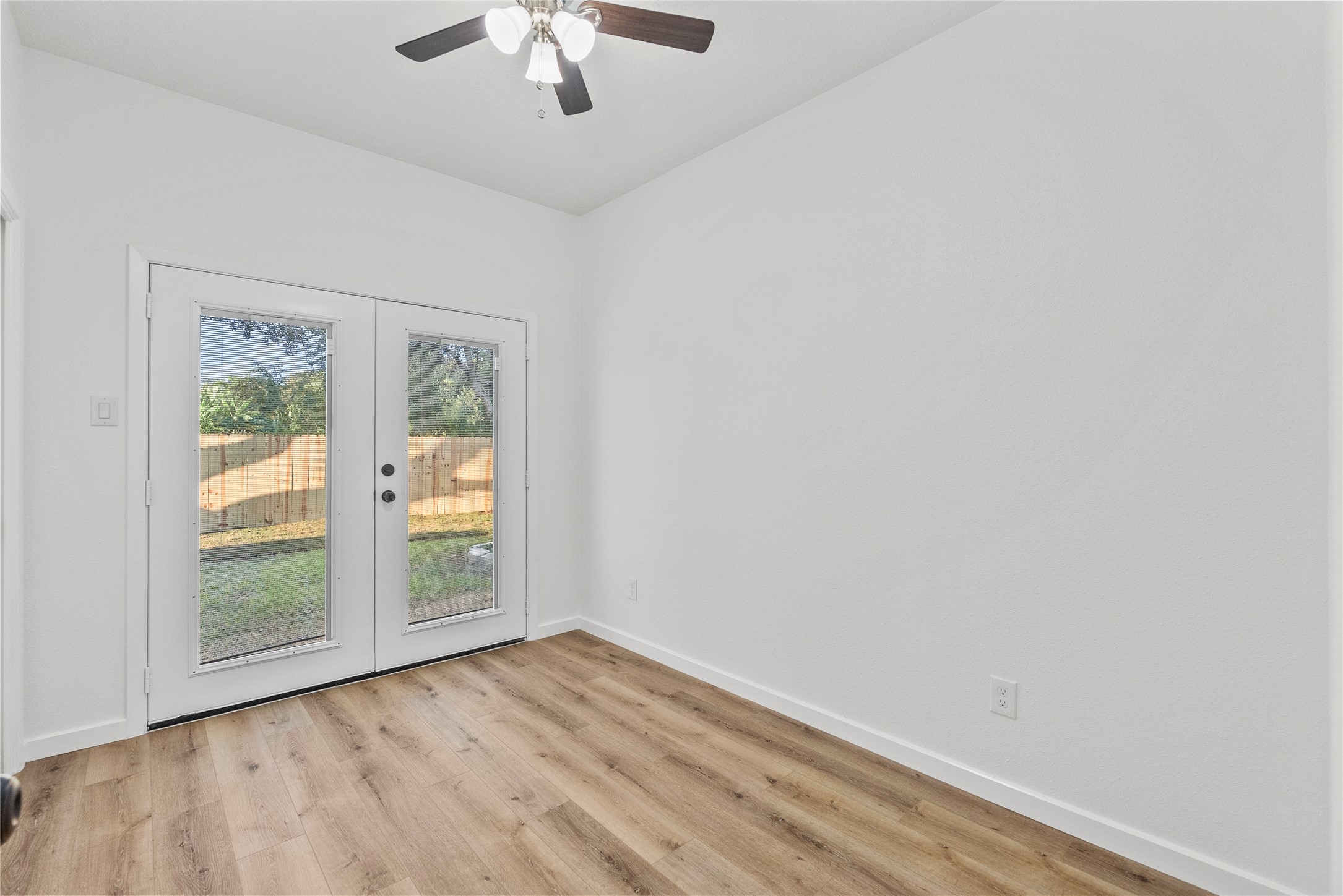 617 Prairie Lane Angleton, TX 77515 - Photo 7 of 14 Perfect space for a home office, flex or a fourth bedroom, featuring French doors leading to the backyard.