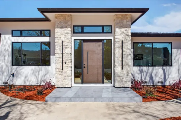 a view of outdoor space with porch and wooden floor