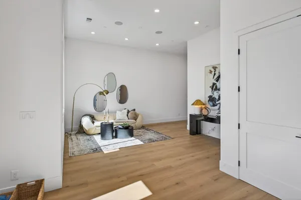 a living room with furniture and a table