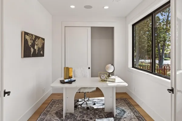 a bed room with a bed and a window