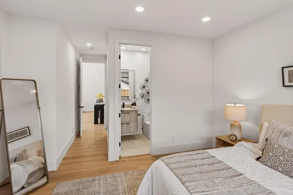 a bedroom with bed and a window