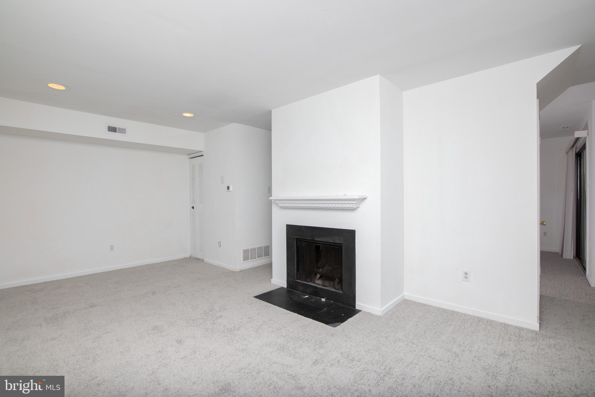 402 Gregorys Way Voorhees, NJ 08043 - Photo 2 of 27 a living room with furniture and a fireplace