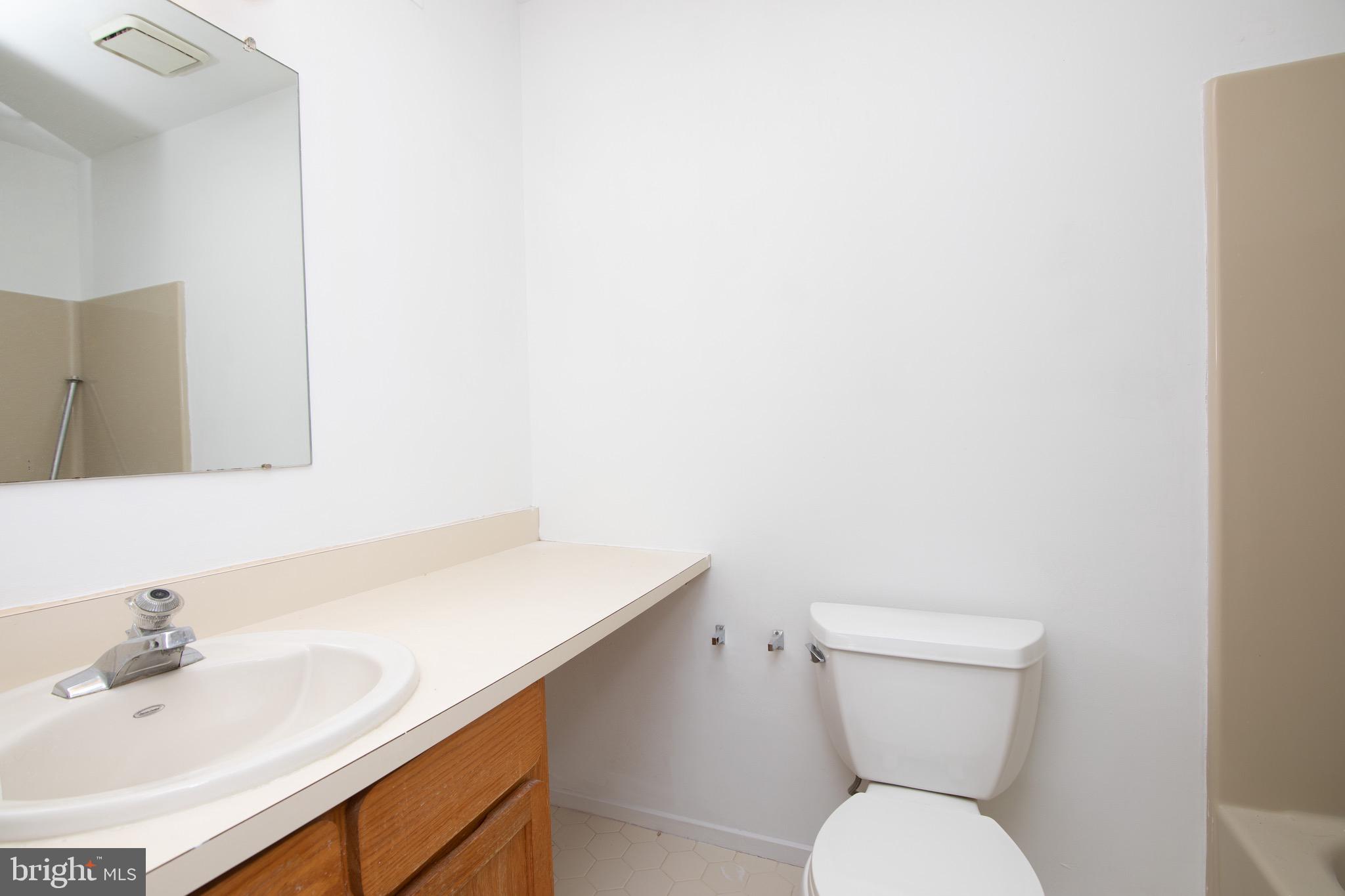402 Gregorys Way Voorhees, NJ 08043 - Photo 13 of 27 a bathroom with a sink a toilet and mirror