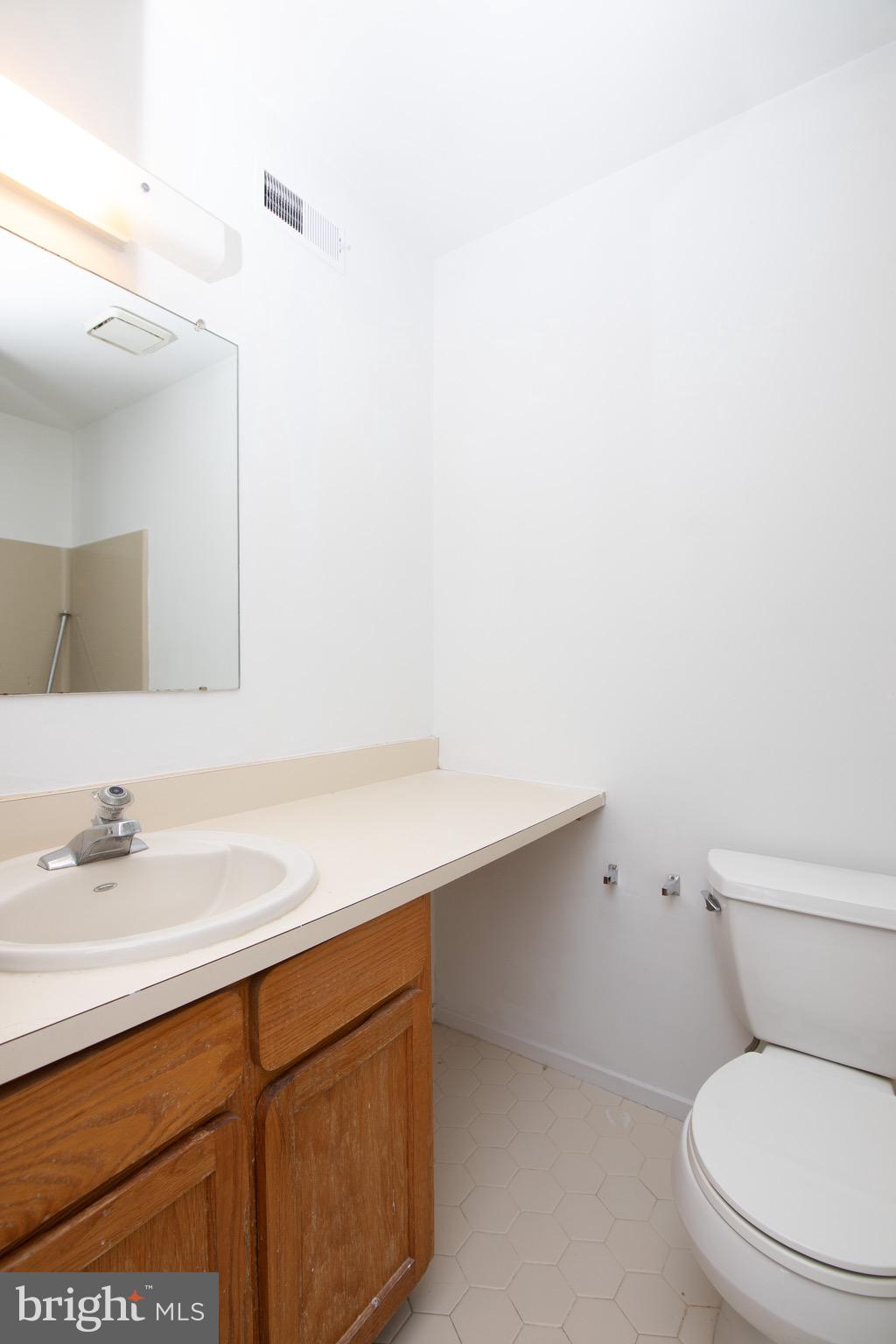 402 Gregorys Way Voorhees, NJ 08043 - Photo 14 of 27 a bathroom with a sink a toilet and mirror