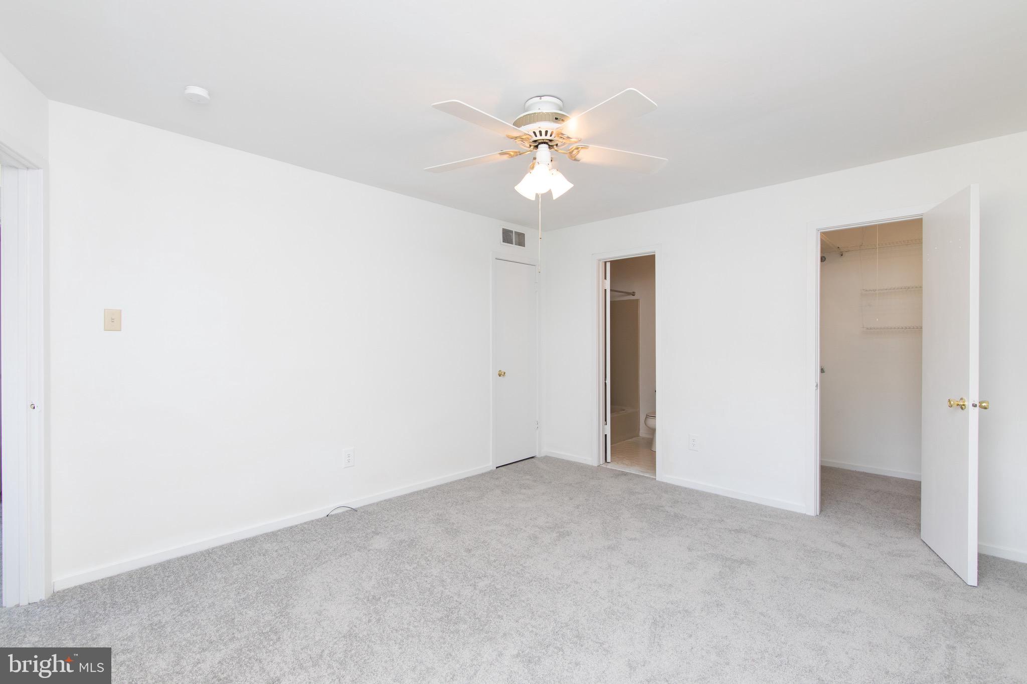402 Gregorys Way Voorhees, NJ 08043 - Photo 22 of 27 a view of an empty room with a fan