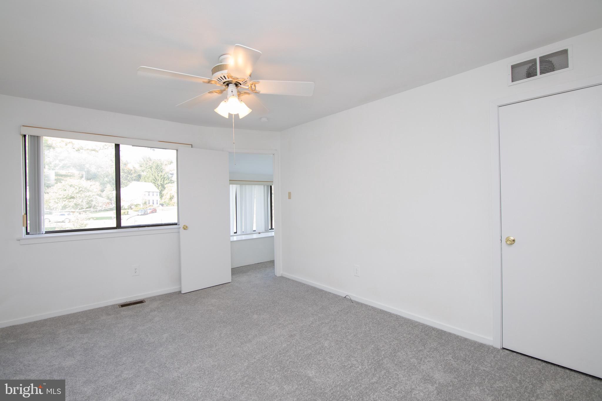 402 Gregorys Way Voorhees, NJ 08043 - Photo 24 of 27 a view of an empty room with a window
