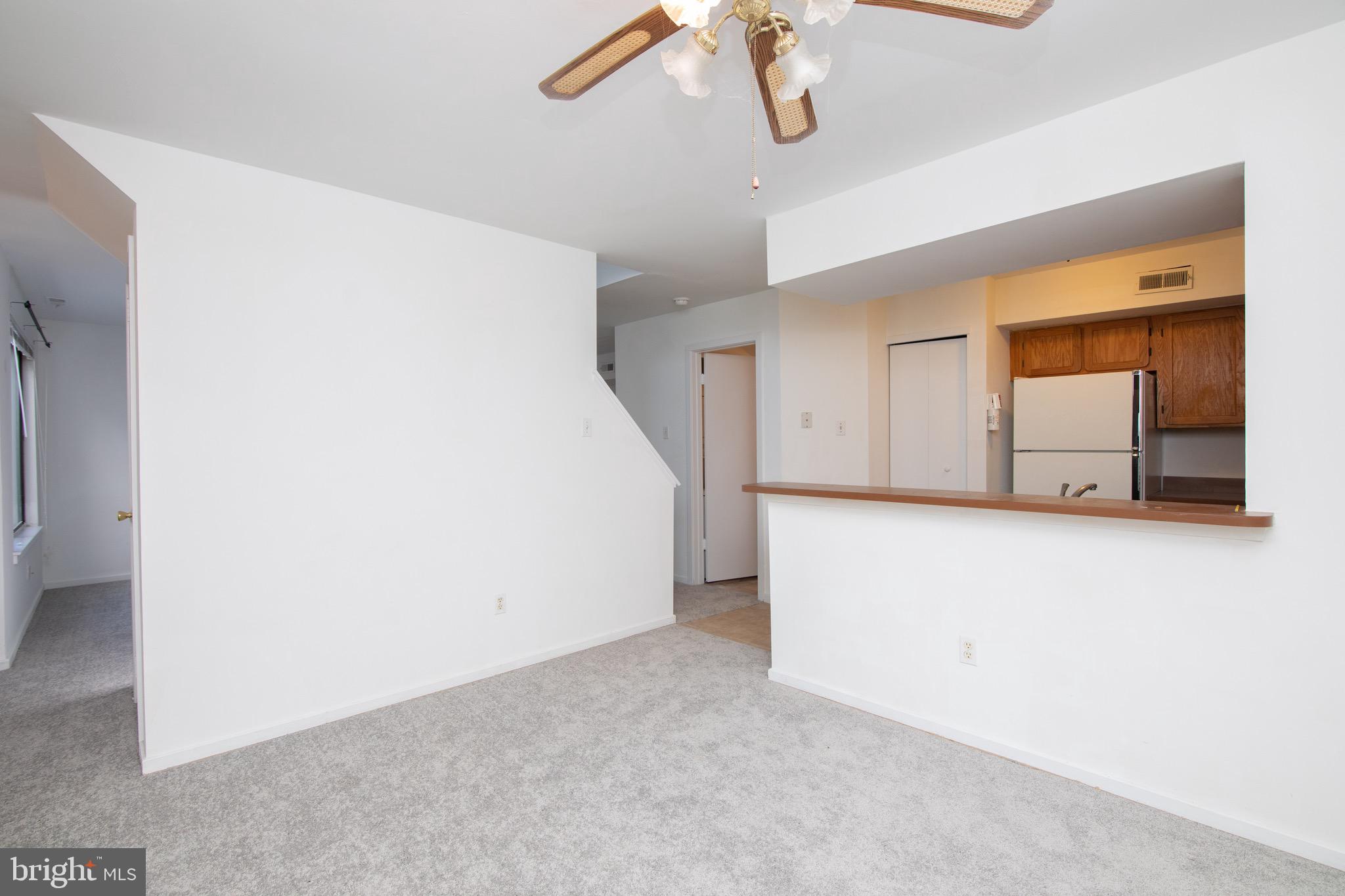 402 Gregorys Way Voorhees, NJ 08043 - Photo 5 of 27 a view of a livingroom with a ceiling fan and wooden floor