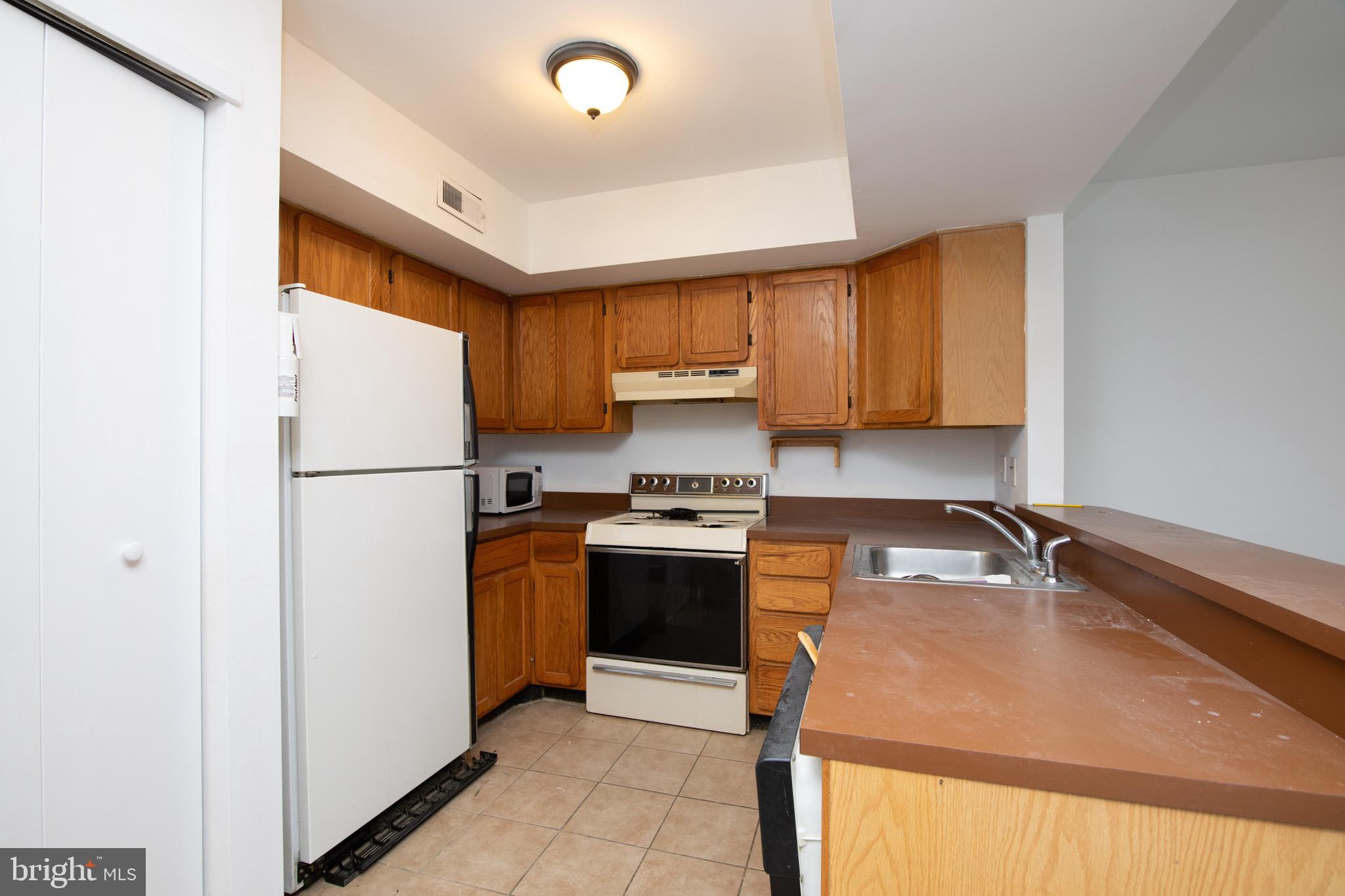 402 Gregorys Way Voorhees, NJ 08043 - Photo 6 of 27 a kitchen with stainless steel appliances granite countertop a refrigerator sink and stove