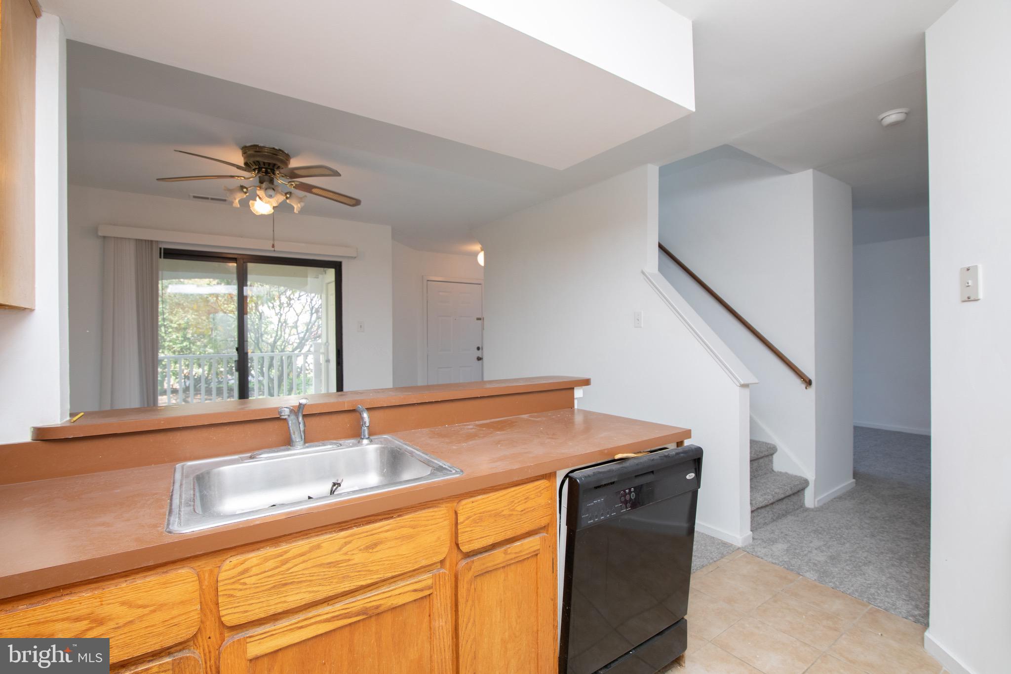 402 Gregorys Way Voorhees, NJ 08043 - Photo 7 of 27 a kitchen with a sink cabinets and a window