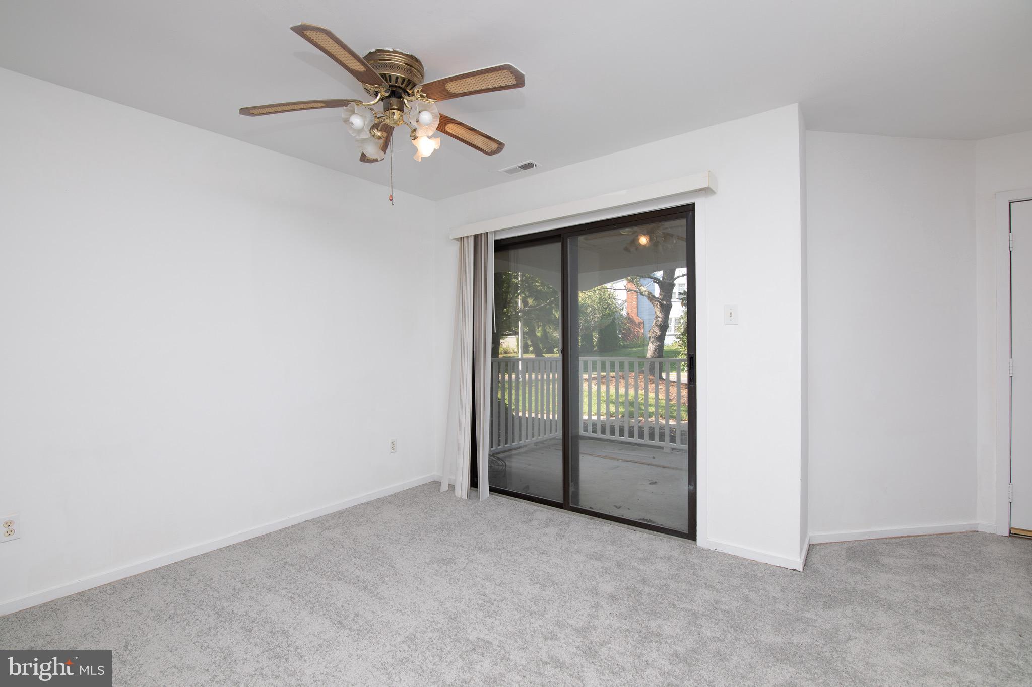 402 Gregorys Way Voorhees, NJ 08043 - Photo 9 of 27 an empty room with fan