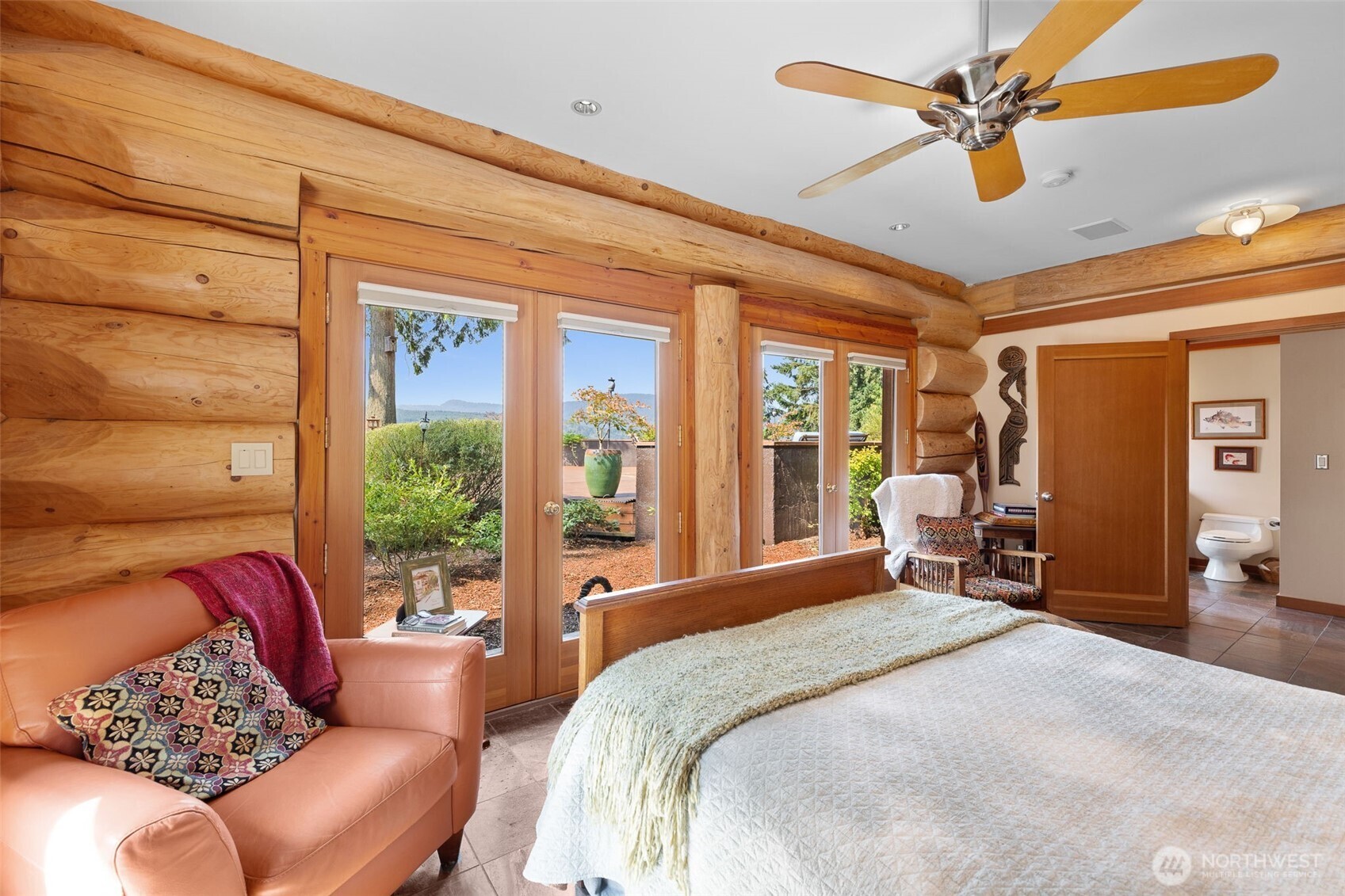 550 Manley Road Bellingham, WA 98229 - Photo 27 of 40 a bedroom with a bed couch and a large window