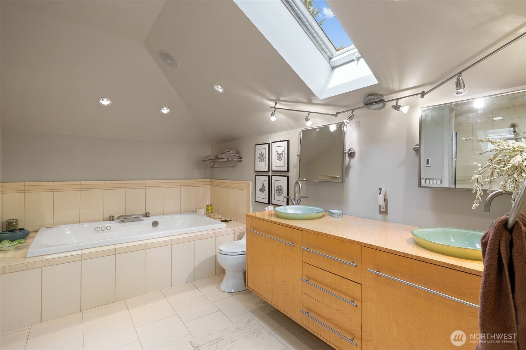550 Manley Road Bellingham, WA 98229 - Photo 30 of 40 a spacious bathroom with a double vanity sink mirror and bathtub