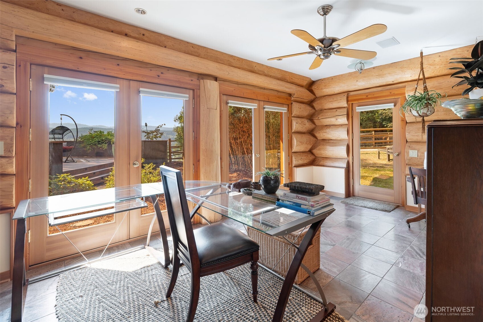 550 Manley Road Bellingham, WA 98229 - Photo 31 of 40 a dining room with furniture a chandelier and wooden floor