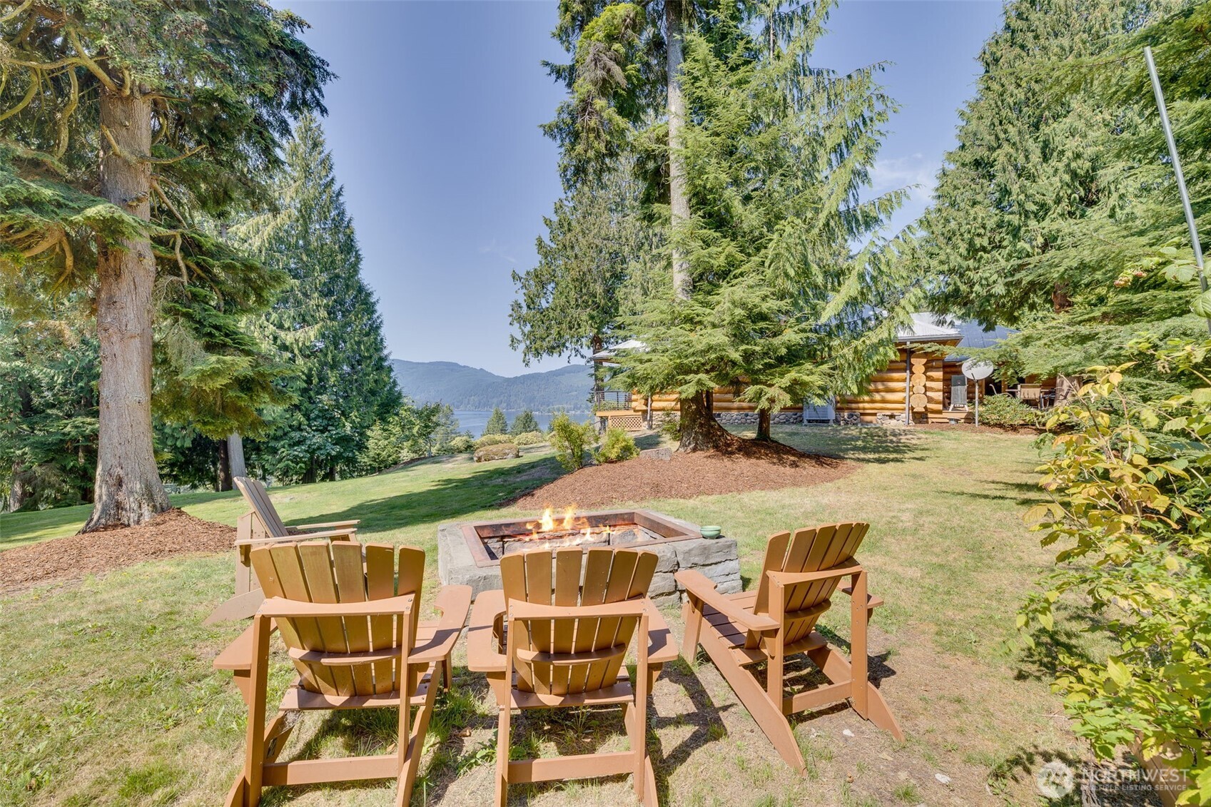 550 Manley Road Bellingham, WA 98229 - Photo 33 of 40 a patio with table and chairs and potted plants