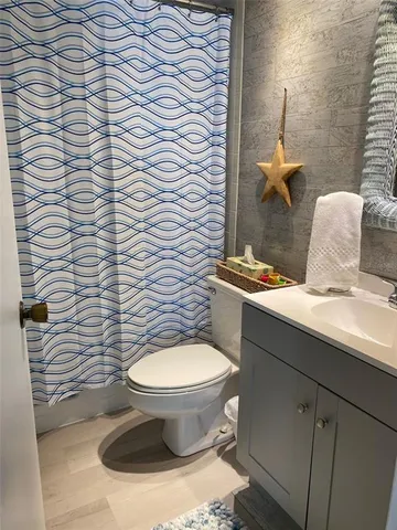 a bathroom with a toilet and a sink