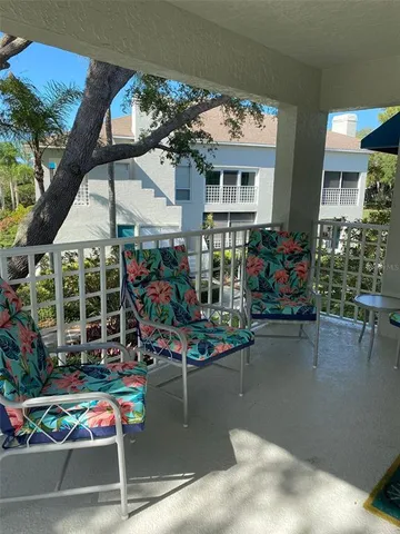 an outdoor space with lots of water fountain in the background