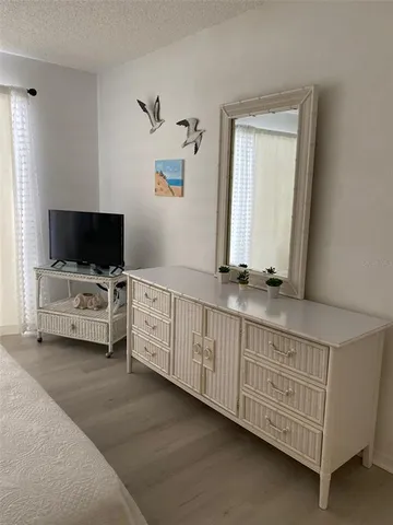 a view of living room with furniture and flat screen tv