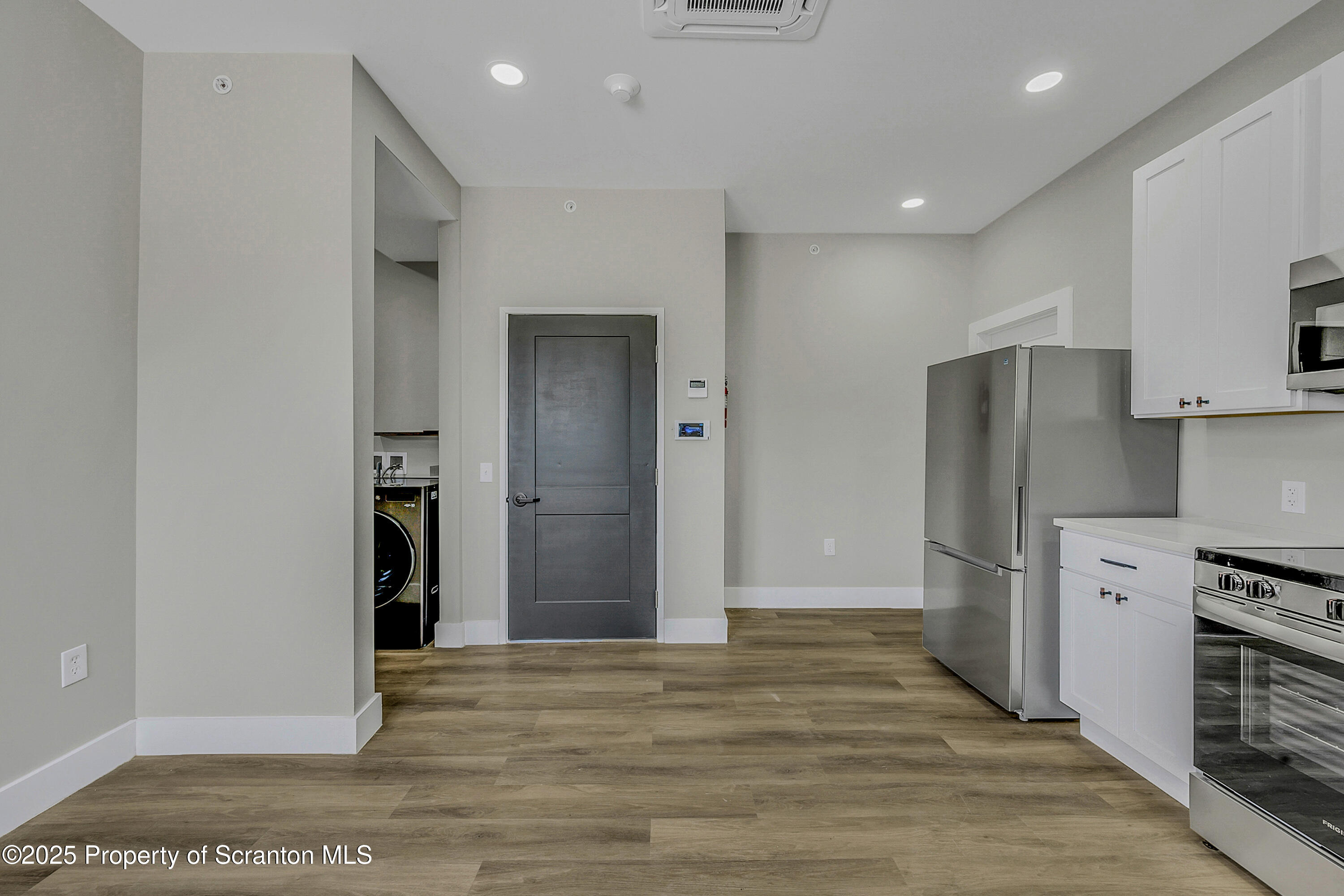 215 Hickory Street, Unit 11 Scranton, PA 18505 - Photo 4 of 13 a view of kitchen with refrigerator and cabinets